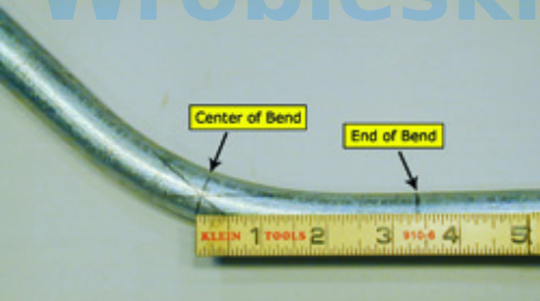 <p>Question 27</p><p>What is the value for the 45° radius adjustment as shown in the photo? (If necessary, review the information in Chapter 4 of the Conduit Bending and Fabrication book on how to find the center of a bend.)</p><p></p><p>a. 1"</p><p>b. 2 3/4"</p><p>c. 3 3/8"</p><p>d. 3 7/8"</p>